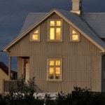 home lit up in early evening time