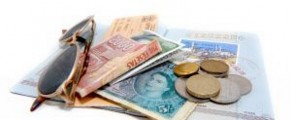 passport, sunglasses and foreign money