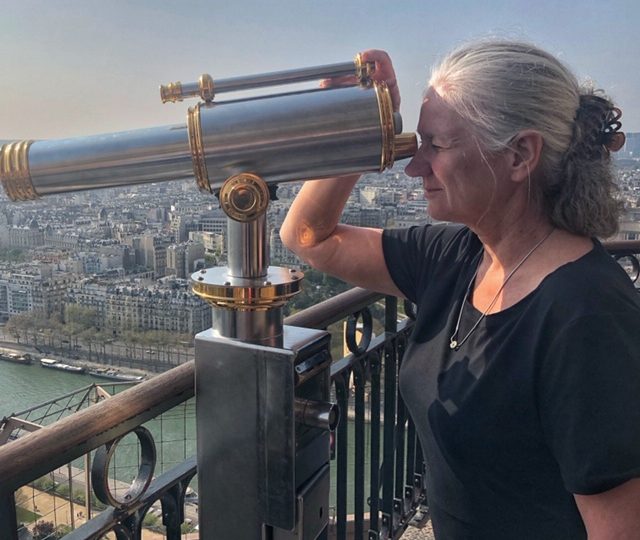 wearing travelsmith clothes while on the summit of the eiffel tower in paris