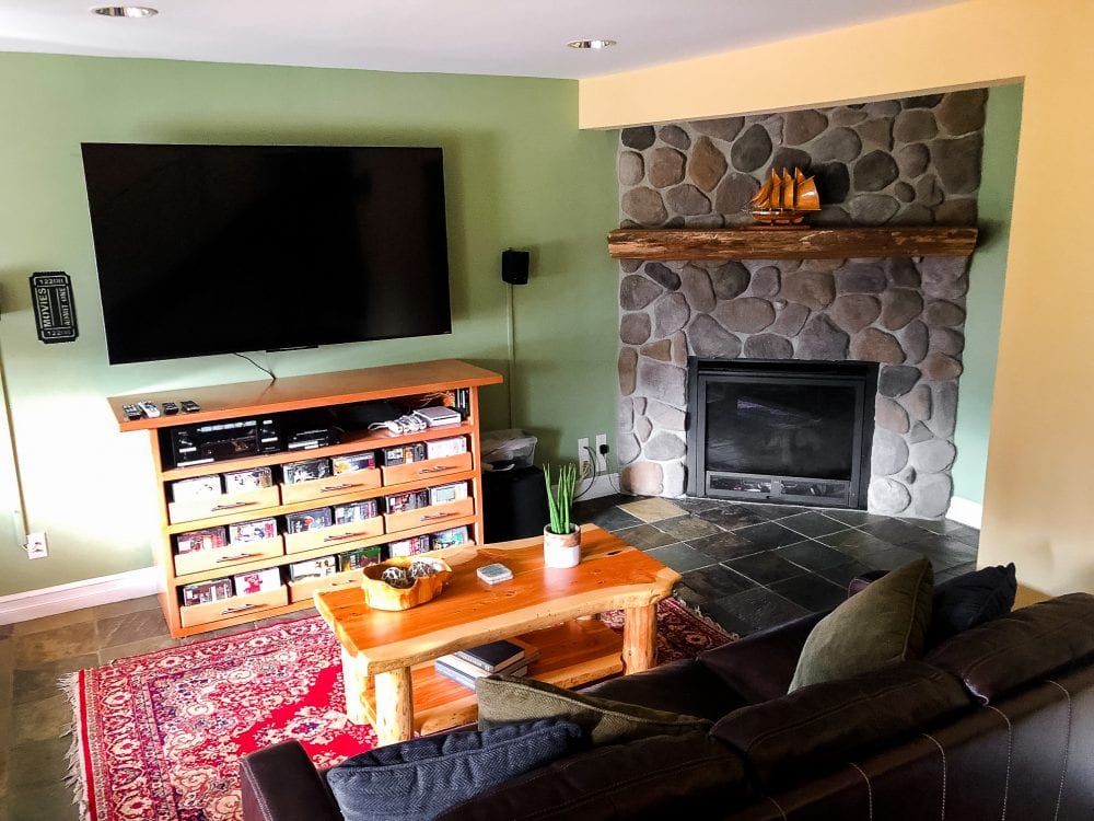 Family room with fireplace and televisions
