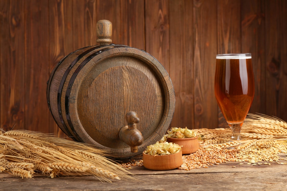 Beer keg, hops, and a glass of beer