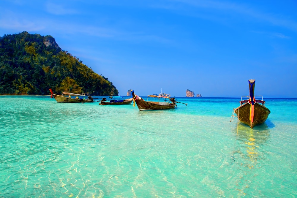 Longtailboats tied up in the turquoise waters at Krabi, Thailand