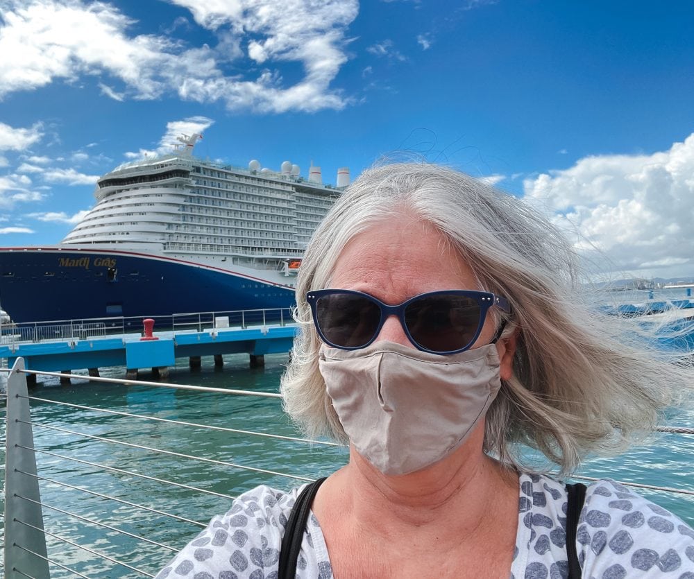 Mary Jo standing in front of the new Mardi Gras from Carnival Cruise Lines