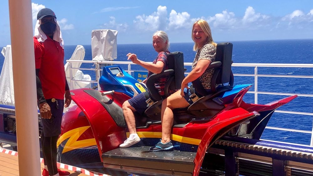 a roller coaster on a cruise ship with a view of the ocean