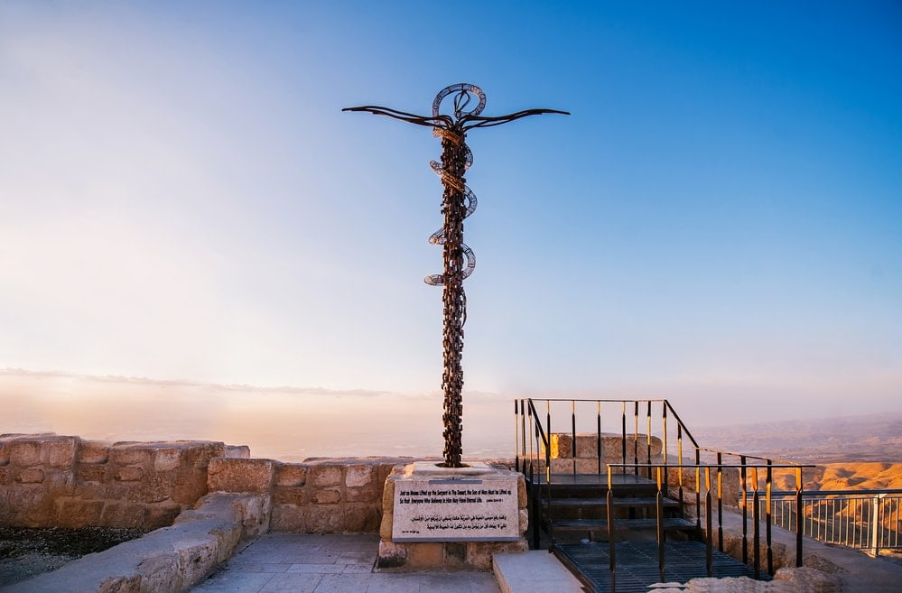 The cross at Mount Nebo near Amman in Jordan on sunset