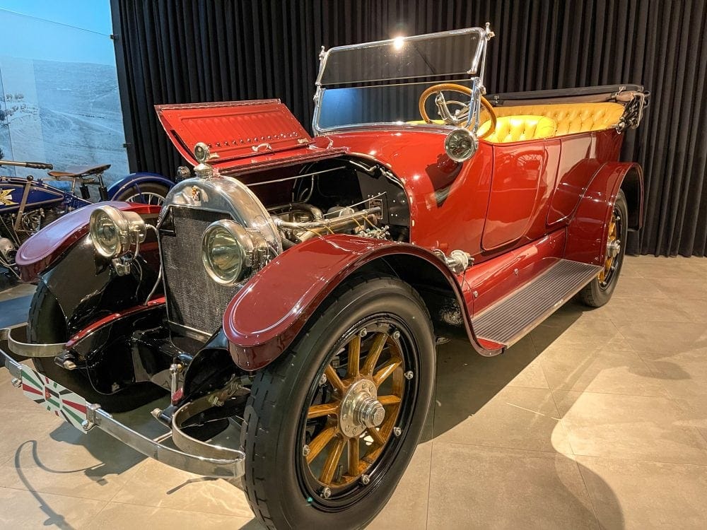 a red old style touring car