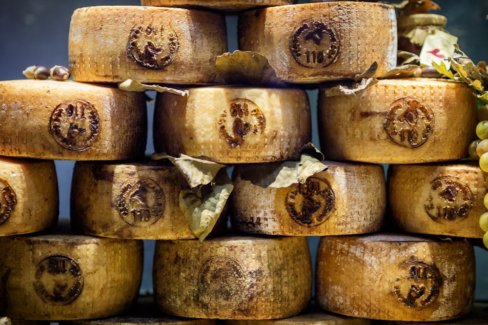 stacked wheels of pecorino cheese