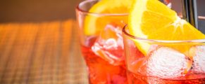 Best Aperol Spritz: A Complete Guide to the Classic Italian Cocktail (with Recipe) 3 Aperol Spritz cocktail with orange slices, ice, and straws, perfect for summer drinks.