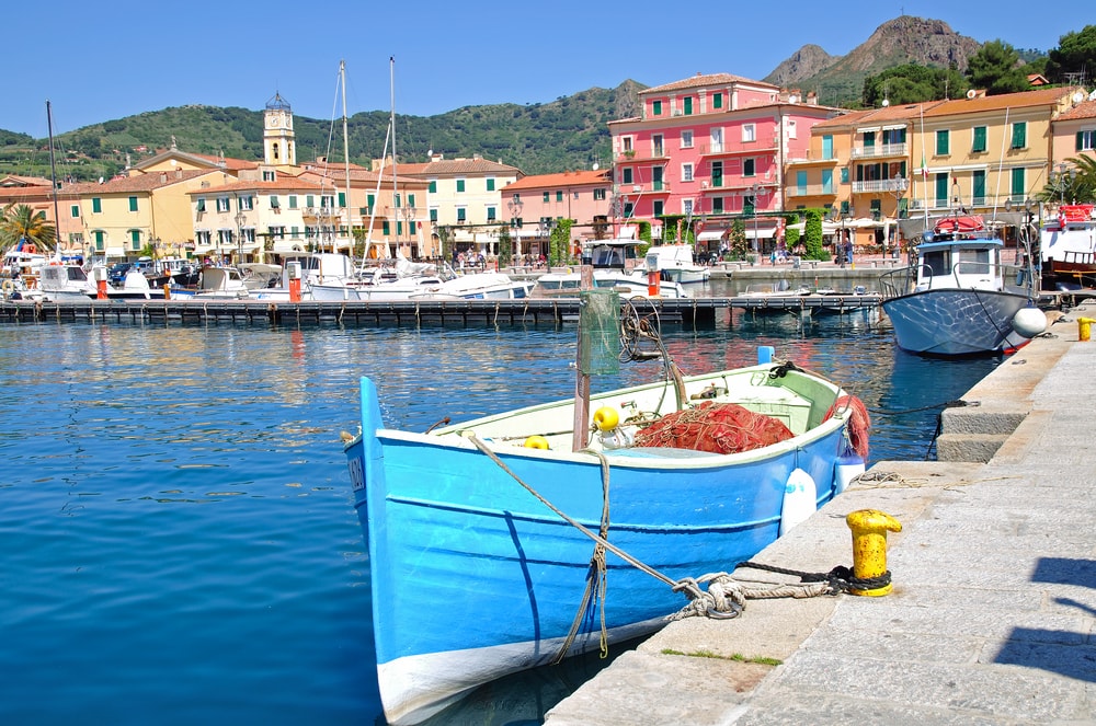 boats docked in the bay of porto azzurro on the tuscan island of elba