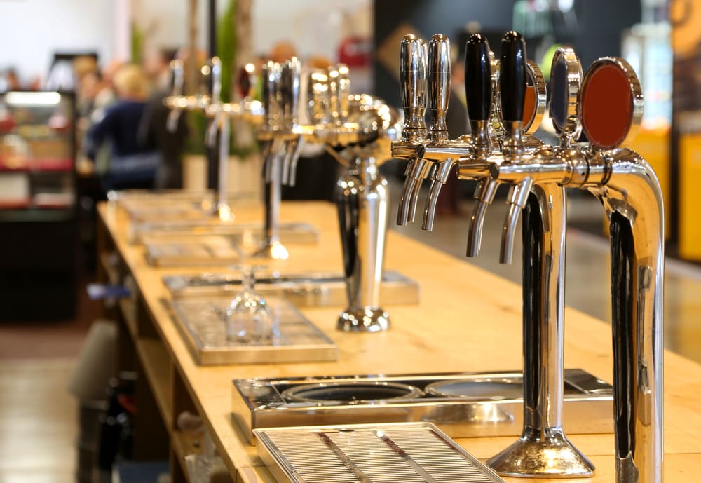 a row of beer taps at an irish pub in dubln