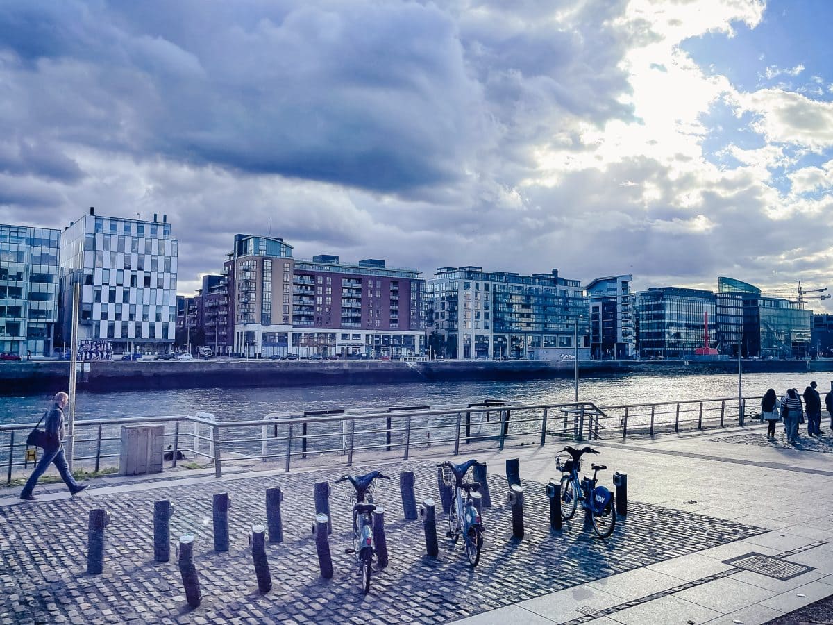 a man walking along the grand canal in dublin ireland