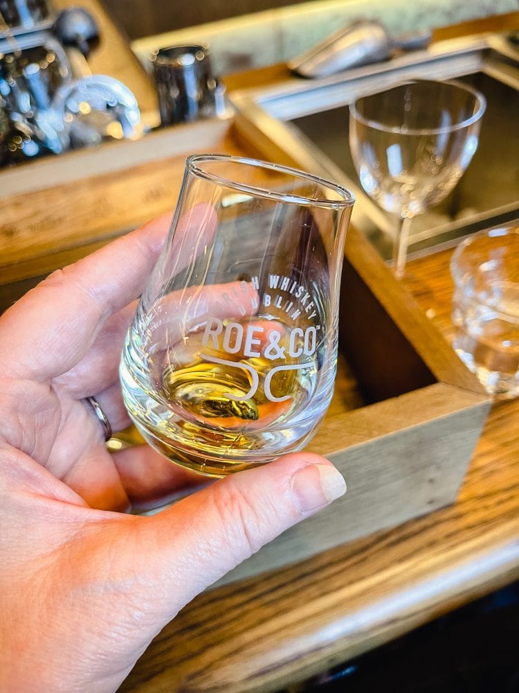 a shot glass of irish whiskey distributed as part of a cocktail making class