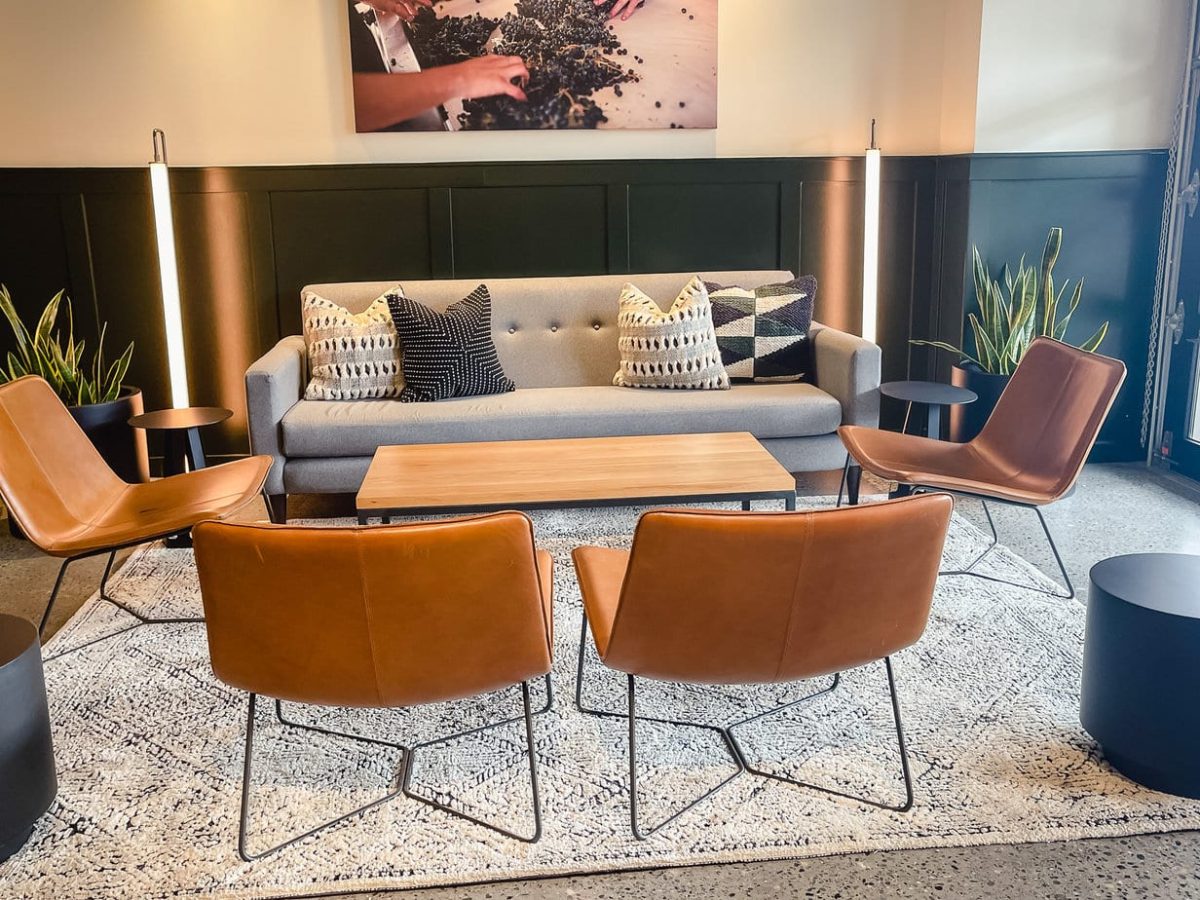 couch chair and tables in a conversational setting for wine tasting