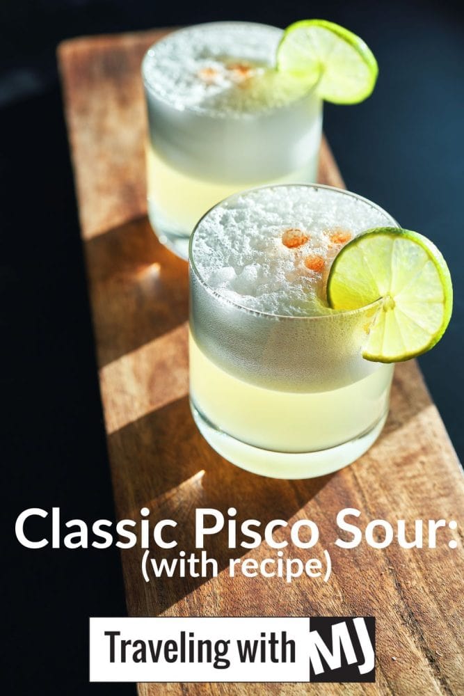 two pisco sour cocktails on a serving board