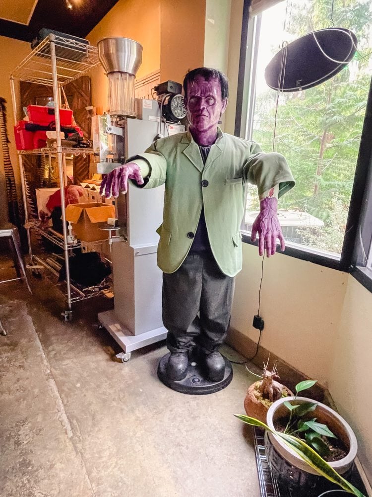 a life size figure of frankenstein in a wine tasting room in woodinville washington
