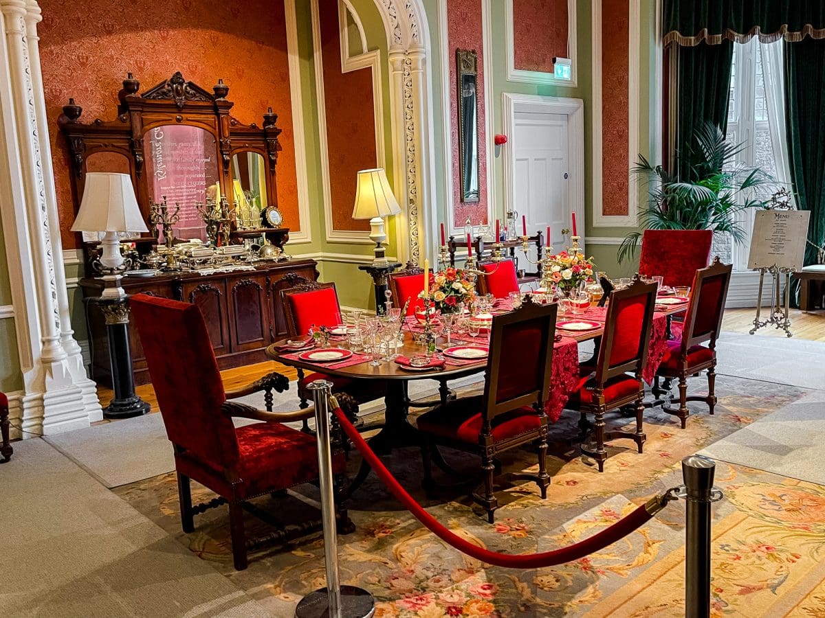 formal dining room in red victorian era decor