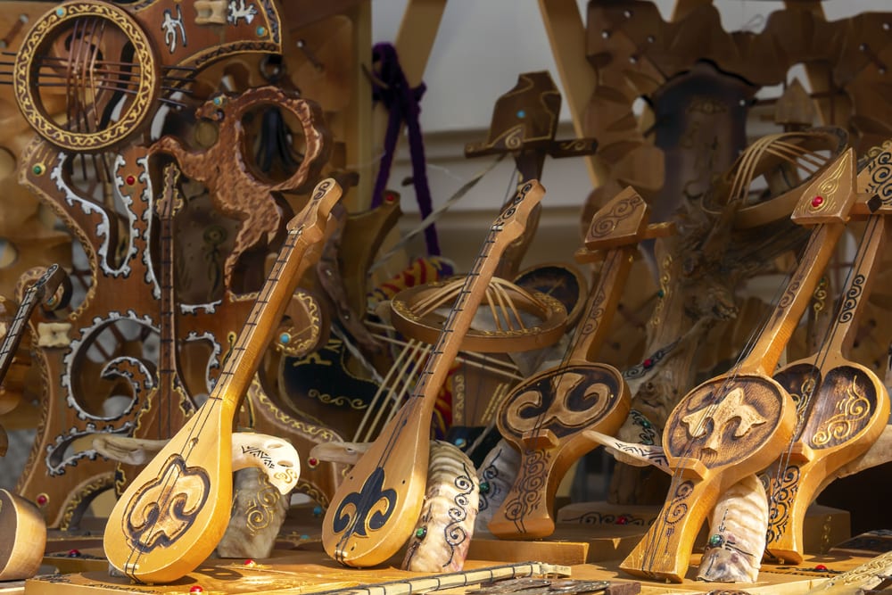 Kazakh national musical instruments handmade with horsehair strings for sale on a sunny day