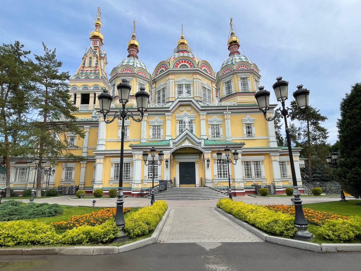 the yellow exterior of Zenkov Cathedral in Almaty, Kazakhstan
