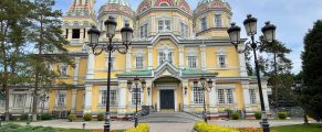 the yellow exterior of Zenkov Cathedral in Almaty, Kazakhstan