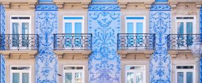 Decorative Portuguese Azulejos Tiles: History & Culture Significance 12 Colorful Portuguese building with azulejo tile art, urban travel, Portugal architecture.