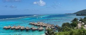 Review: Windstar Star Breeze, Tahiti Itinerary 2 Overwater bungalows with turquoise ocean view at tropical island resort.