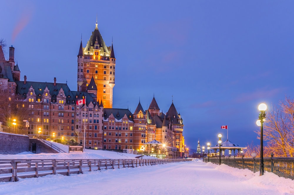 chateau frontenac in quebec city with snowy ground and walkway