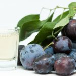 Plums and a glass of wine.