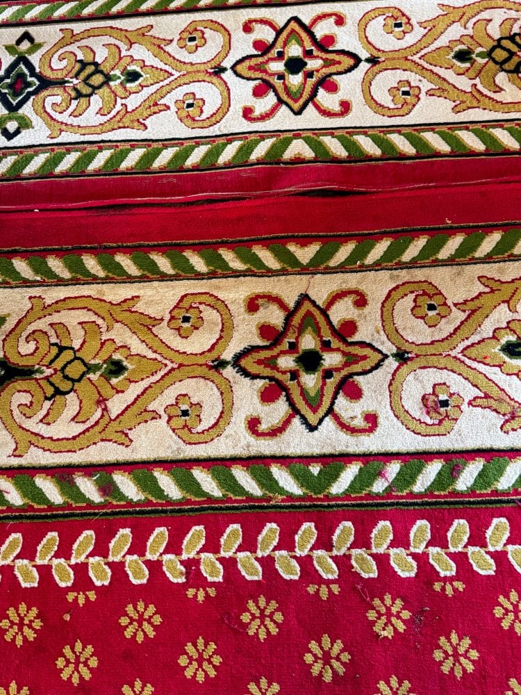 A close up of a red and green fabric in Cambodia.