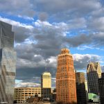 13 Fantastic Museums in Detroit That You Won't Want to Miss Downtown skyscrapers in city skyline under cloudy sky.