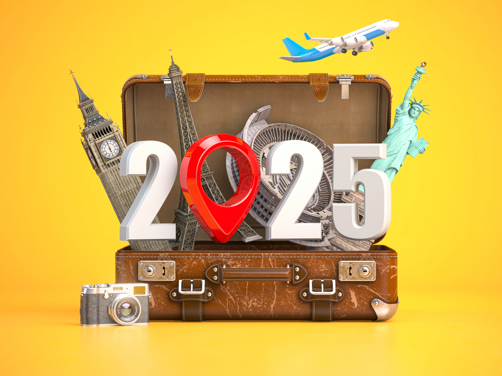 2025: A Year of Travel in Review (and a peek at 2026) 1 Travel-themed suitcase with landmarks and year