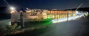 Cruise Review: Riverside Ravel 2 Night view of a cruise ship docked along the river during a Riverside Ravel cruise.