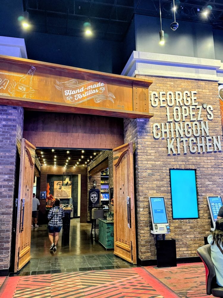 George Lopez's Chingon Kitchen entrance at a casino with digital kiosks outside.